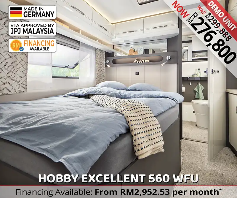 Hobby Excellent 560 WFU double bed sleeping area with soft lighting and premium comfort.