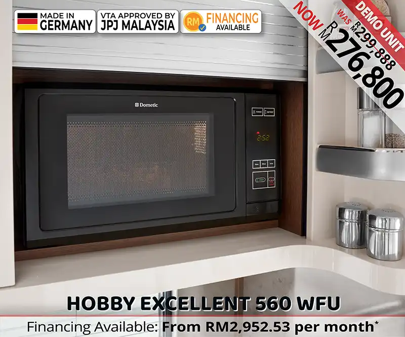 Built-in microwave in the Hobby Excellent 560 WFU caravan kitchen for convenient cooking during Malaysian family trips.