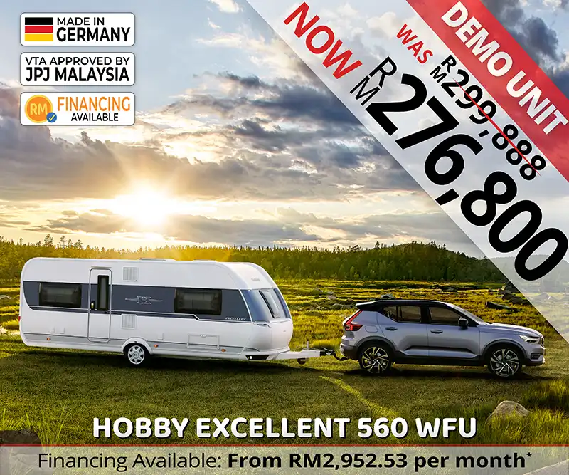 Hobby Excellent 560 WFU caravan travelling along a mountain road, representing premium outdoor adventures and luxury caravanning in Malaysia.