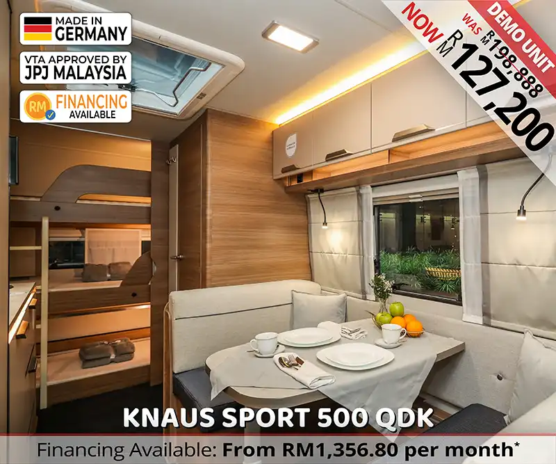 Interior of Knaus Sport 500 QDK caravan viewed from dinette towards rear bunk beds.