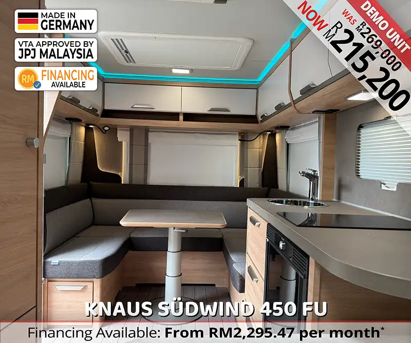 Interior of Knaus Südwind 450 FU caravan with modern layout and comfortable seating for family travel Malaysia.