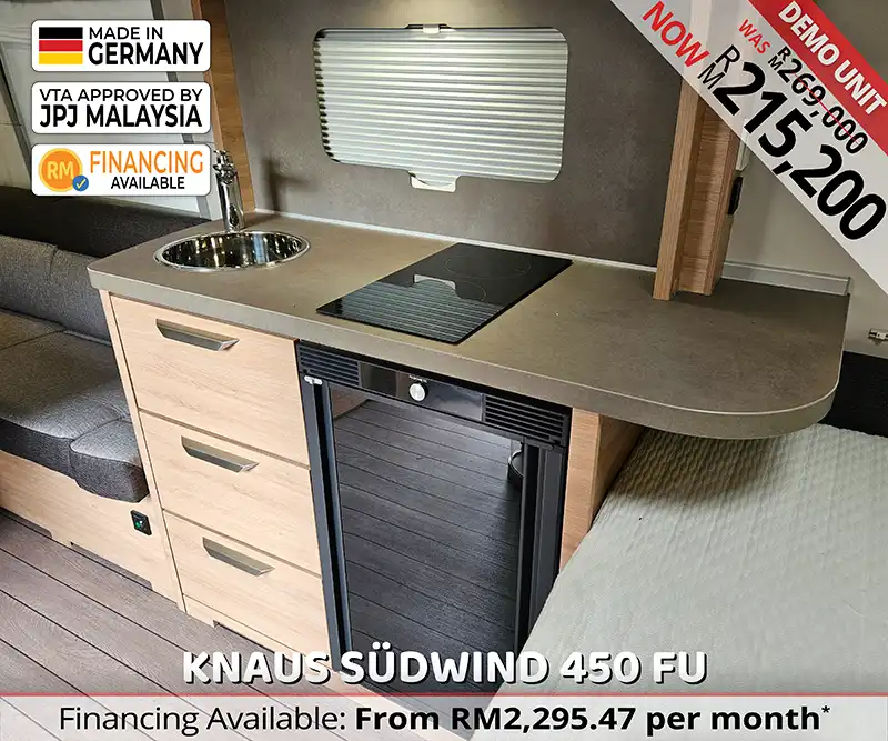The Knaus Südwind 450 FU caravan kitchenette with gas hob, sink, and smart storage for travellers.
