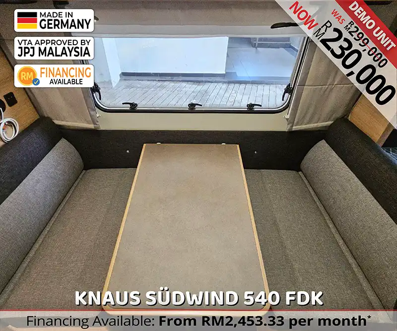 Convertible dining area in Knaus Südwind 540 FDK that turns into a double bed for family caravan trips in Malaysia.