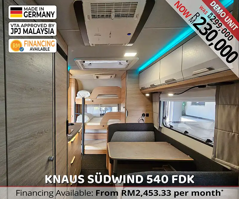 Interior of Knaus Südwind 540 FDK viewed from the dinette showing triple bunk beds at the rear.