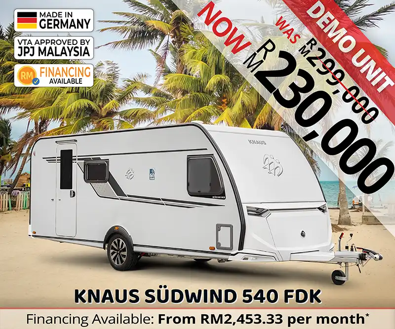 Knaus Südwind 540 FDK caravan parked at a tropical Malaysian beach, combining luxury travel with relaxed coastal living.